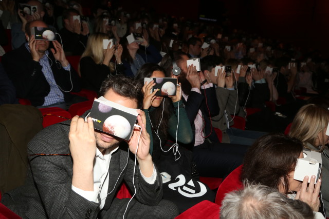 Audience members try out New York Times' VR experience. (Source: IOB)