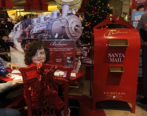 IMAGE DISTRIBUTED FOR MACY'S - Jacob Galvin, 11, of Esperance, N.Y., visits the letter writing station at a National Believe Day 2015 celebration at Macy's in Colonie, N.Y., on Friday, Dec. 11, 2015. Make-A-Wish announced that Galvin will receive his wish of a classic train trip from Chicago to New Orleans. The Believe campaign includes letters to Santa which result in donations from Macy's to Make-A-Wish. (Tim Roske/AP Images for Macy's)