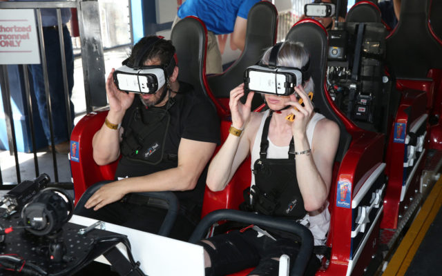 Guests don VR headsets on the Six Flags Revolution roller coaster. Source: Six Flags