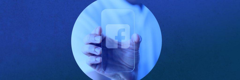 Hand Holding Transparent Smartphone Displaying Facebook Logo