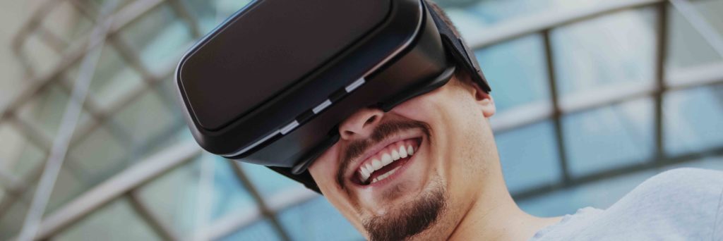 Excited Man Wearing VR Headset