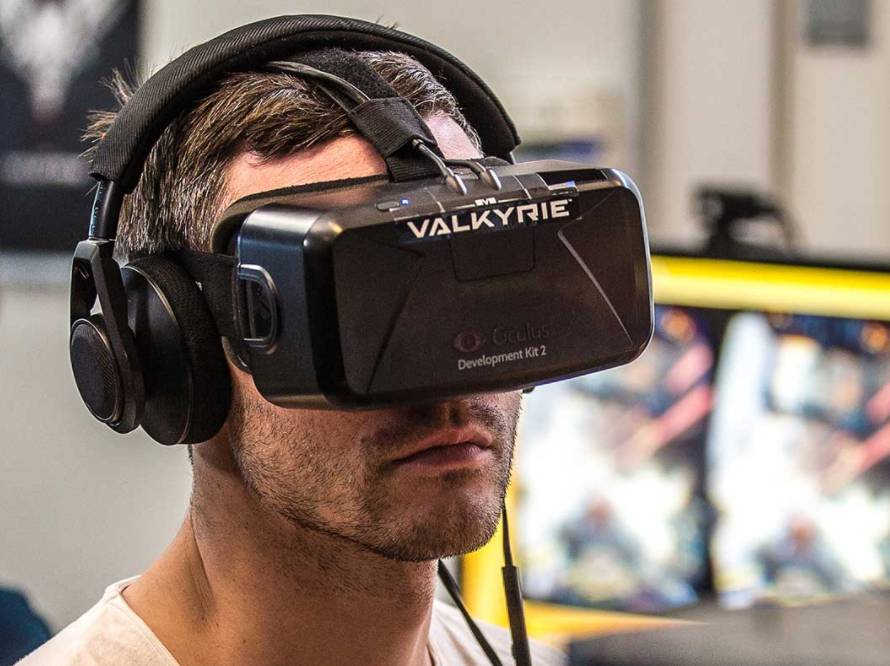 Man wearing Eve Valkyrie VR headset
