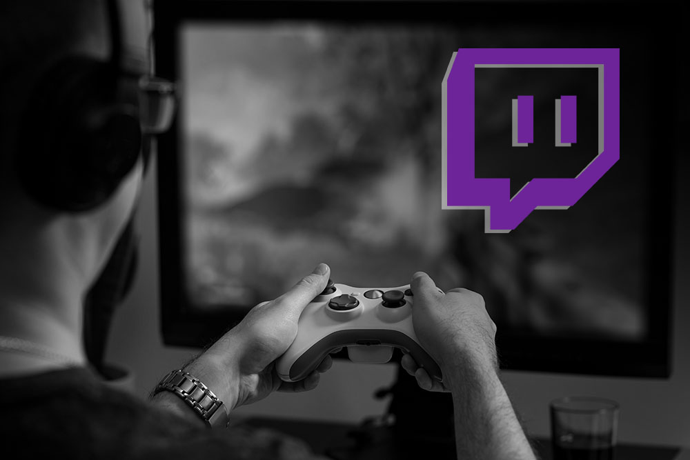 Twitch logo and Gamer using console and livestream