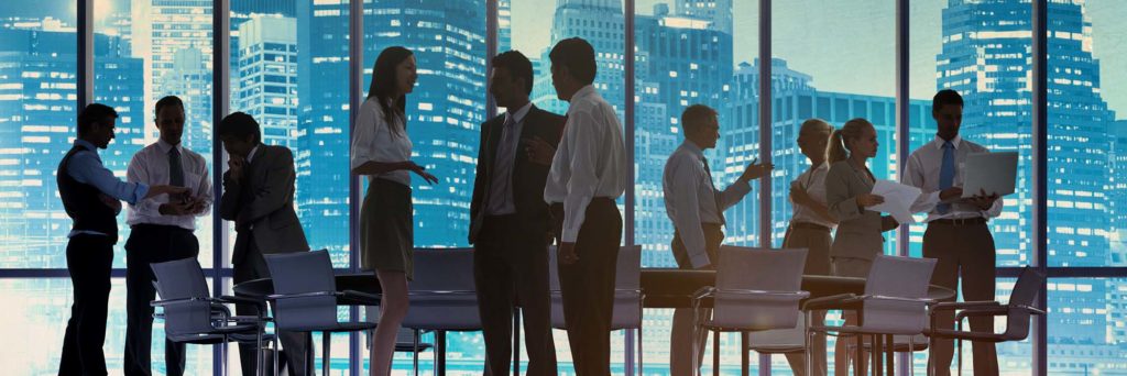 People in boardroom discussing partnerships and strategy for brands