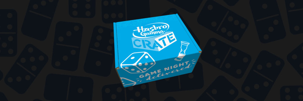 Hasbro Game Crate shipping box with dominos gaming pieces background