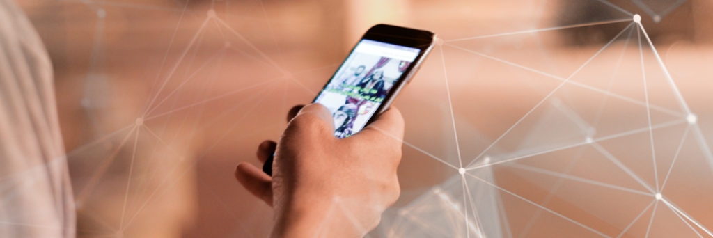 iphone in hand surrounded by data net