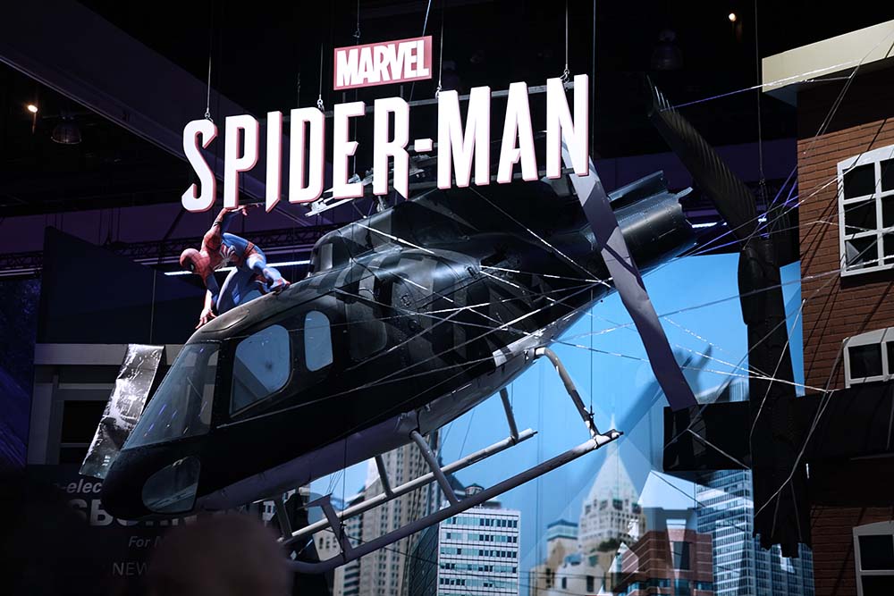 Image of spider man hanging on helicopter at e3