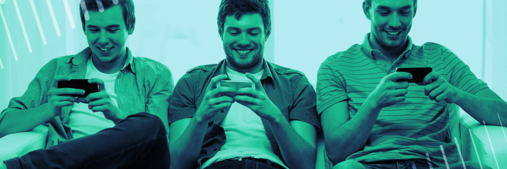 Group of millennial men using mobile gaming apps