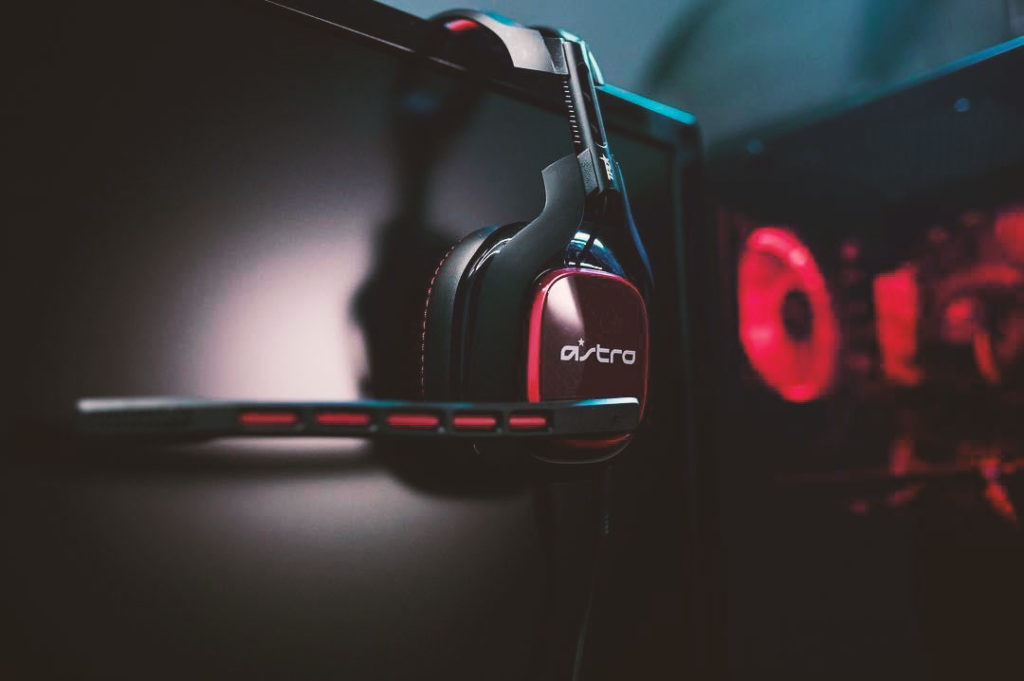 Astro gaming Esports headset resting on computer screen