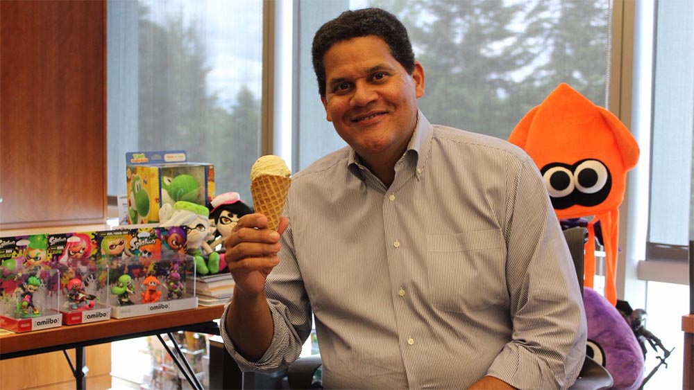 Reggie Fils-Aime holding ice cream cone celebrating Splatfest