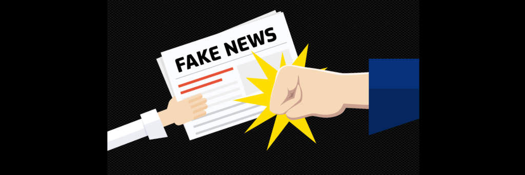 Hand punches fake news article