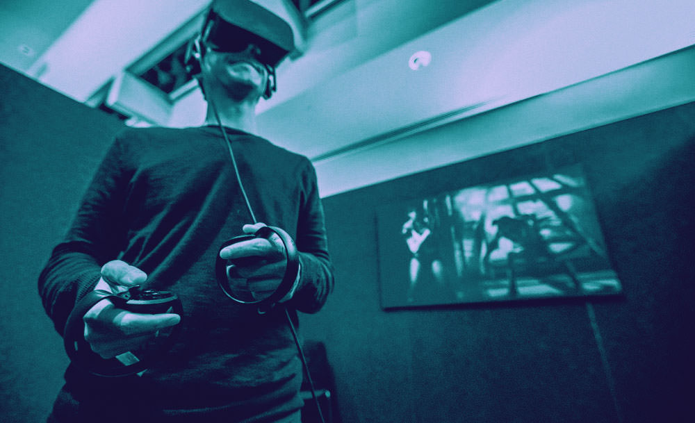 Man playing Oculus Rift Virtual Reality Set