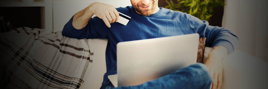 Man using credit card to make purchase