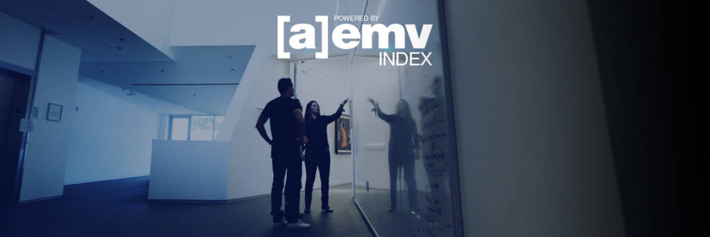 People comparing data on a whiteboard in office