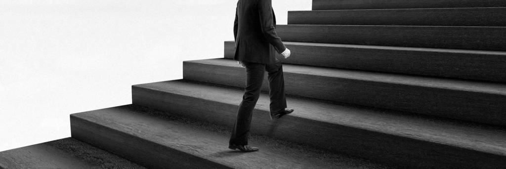 CMO walking up flight of stairs