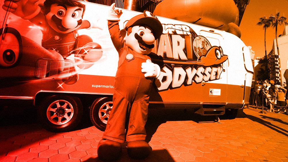 Mario standing in front of a custom Odyssey themed airstream trailer