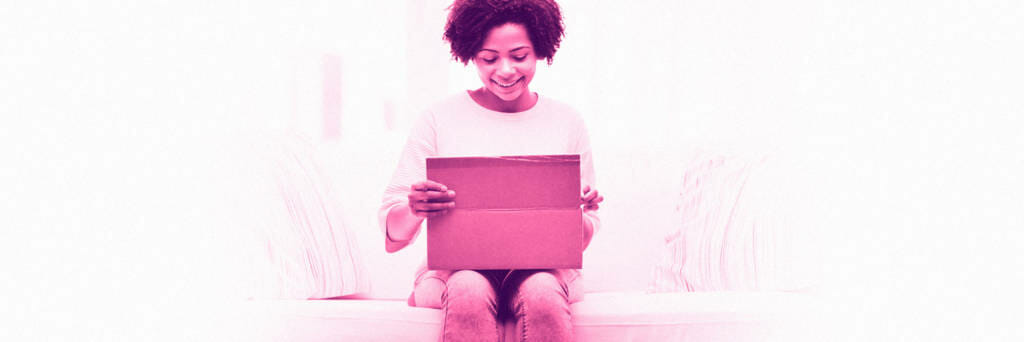 woman opening subscription box