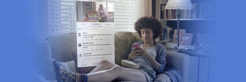 Woman sits on couch using Facebook Watch App