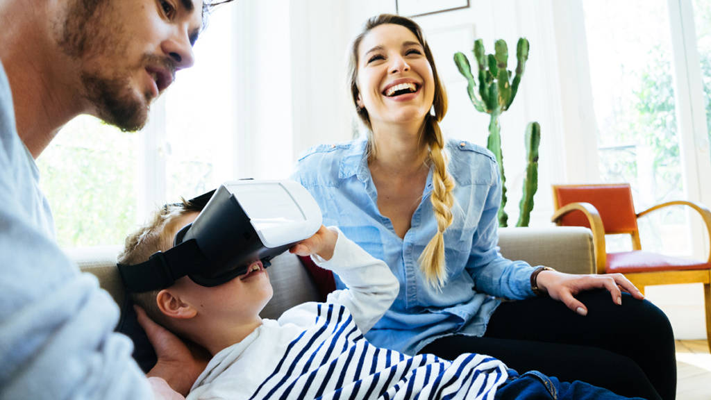 Happy family together playing VR