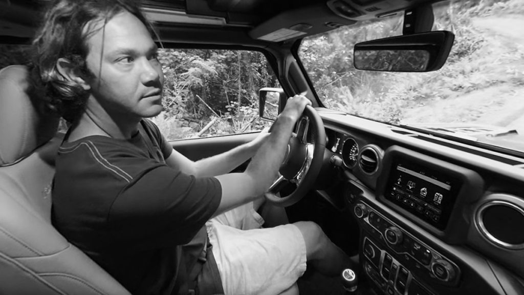 Surfer from Jeep World Surf League 360 Experience Driving jeep to surf location