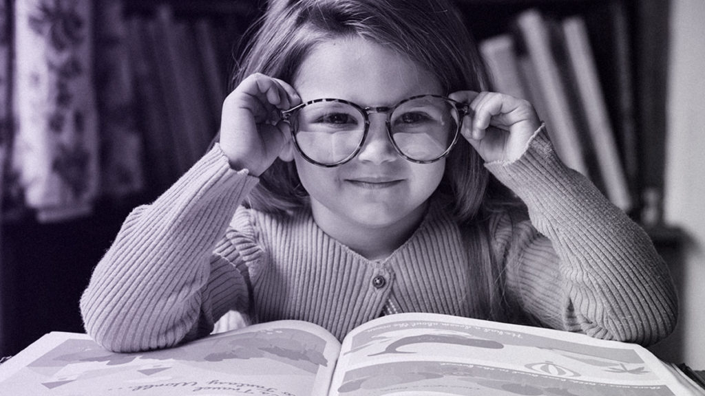 a smart child reading a book