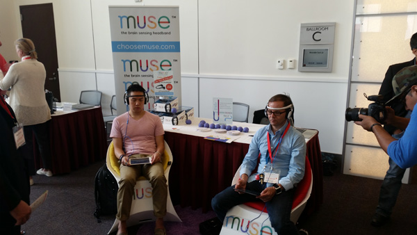 Attendees try on Muse's headband outfitted with brain sensors.